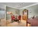 Dining room with hardwood floors, crown molding, and adjacent to a modern kitchen at 175 15Th Ne St # 304, Atlanta, GA 30309