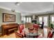 Dining area with hardwood floors, with views into the living room, featuring a piano and dining set at 175 15Th Ne St # 304, Atlanta, GA 30309