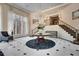 Grand foyer with elegant chandelier, staircase, and tiled flooring at 175 15Th Ne St # 304, Atlanta, GA 30309