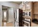 Kitchen view showcasing stainless steel appliances and open access to the living spaces at 175 15Th Ne St # 304, Atlanta, GA 30309