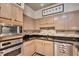 Cozy kitchen featuring stainless steel appliances and light wood cabinetry at 175 15Th Ne St # 304, Atlanta, GA 30309
