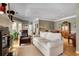Open living room with hardwood floors, neutral sofa, fireplace, and access to dining area at 175 15Th Ne St # 304, Atlanta, GA 30309
