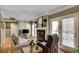 Bright living room featuring a fireplace, comfortable seating, and access to an outdoor space at 175 15Th Ne St # 304, Atlanta, GA 30309