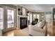 Living room with fireplace, hardwood floors, access to balcony, and comfortable seating at 175 15Th Ne St # 304, Atlanta, GA 30309