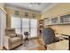Bright office space featuring a large window, built-in shelving, and comfortable chair at 175 15Th Ne St # 304, Atlanta, GA 30309