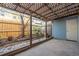 Backyard features a covered patio area, gravel landscaping, and wooden fence at 2859 Spring Villa Se Ln, Smyrna, GA 30080