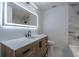 Modern bathroom featuring a vanity with an illuminated mirror and a tub at 2859 Spring Villa Se Ln, Smyrna, GA 30080