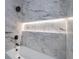 Bathroom showing a white marble tiled shower with a built-in niche at 2859 Spring Villa Se Ln, Smyrna, GA 30080