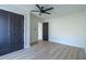 Bedroom with new hardwood floors, ceiling fan, and closet doors at 2859 Spring Villa Se Ln, Smyrna, GA 30080