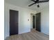 Bedroom with new hardwood floors, ceiling fan, and neutral walls at 2859 Spring Villa Se Ln, Smyrna, GA 30080