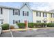 Exterior shot of home displaying landscaping, parking, and colorful front door at 2859 Spring Villa Se Ln, Smyrna, GA 30080