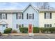 Charming exterior of a two-story home with a well-maintained front yard and colorful front door at 2859 Spring Villa Se Ln, Smyrna, GA 30080