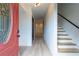 An inviting foyer featuring stairs with modern railing and wood steps, and neutral-toned walls at 2859 Spring Villa Se Ln, Smyrna, GA 30080