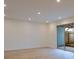 Bright living room featuring recessed lighting, sliding glass doors, and neutral-toned flooring and walls at 2859 Spring Villa Se Ln, Smyrna, GA 30080