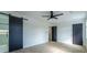 Stylish main bedroom featuring hardwood floors, black sliding door, and ensuite access at 2859 Spring Villa Se Ln, Smyrna, GA 30080