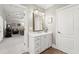 This bathroom offers a single sink vanity with a door into the living room at 8730 Parker Pl, Roswell, GA 30076