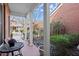 Relaxing covered front porch with brick flooring and views of the peaceful neighborhood at 8730 Parker Pl, Roswell, GA 30076