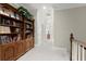 Spacious hallway with beautiful built-in bookcase at 8730 Parker Pl, Roswell, GA 30076