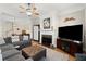 Cozy living room that is adjacent to dining room and fireplace at 8730 Parker Pl, Roswell, GA 30076