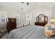 Main bedroom with vaulted ceiling, and windows with plantation shutters at 8730 Parker Pl, Roswell, GA 30076