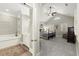 View of the main bedroom from the entry featuring vaulted ceilings and plantation shutters at 8730 Parker Pl, Roswell, GA 30076