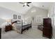 Vaulted ceiling bedroom with ceiling fan, plantation shutters, and neutral decor at 8730 Parker Pl, Roswell, GA 30076