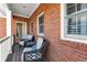 A peaceful porch features comfortable seating at 8730 Parker Pl, Roswell, GA 30076