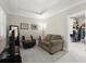 Cozy sitting room with neutral carpet and view into a walk-in closet at 8730 Parker Pl, Roswell, GA 30076