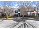 Brick townhouses with manicured front lawns lining the street, showcasing the neighborhood's curb appeal at 8730 Parker Pl, Roswell, GA 30076
