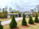 Modern home boasts a long driveway, manicured lawn, stylish design, and large windows at 0 Highway 279, Fayetteville, GA 30214