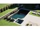 Stylish swimming pool featuring a hot tub, lounge chairs, and a modern design at 0 Highway 279, Fayetteville, GA 30214