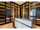 Luxurious walk-in closet features custom storage solutions, glass doors, and stylish design at 0 Highway 279, Fayetteville, GA 30214