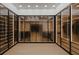 Spacious walk-in closet with wooden shelves and drawers, designed for ample clothing storage at 0 Highway 279, Fayetteville, GA 30214