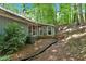 Backyard area with trees and patio at 115 Lake Pines Ct, Roswell, GA 30076