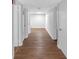 Finished basement featuring wood-style flooring and access to multiple rooms at 115 Lake Pines Ct, Roswell, GA 30076