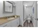 Bathroom featuring granite counters and white cabinetry at 115 Lake Pines Ct, Roswell, GA 30076