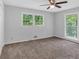 Neutral bedroom with large windows offering plenty of natural light and a ceiling fan at 115 Lake Pines Ct, Roswell, GA 30076
