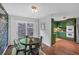 Eat-in kitchen features a dining table and chairs, and opens to the green kitchen at 115 Lake Pines Ct, Roswell, GA 30076