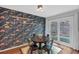 Dining area with fun wallpaper features a sliding door to the backyard at 115 Lake Pines Ct, Roswell, GA 30076