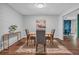 Stylish dining area with wood floors, simple wood table set, and trendy decor at 115 Lake Pines Ct, Roswell, GA 30076