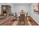Dining area with wood flooring, light wood table, modern chairs and minimalist decor at 115 Lake Pines Ct, Roswell, GA 30076