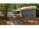 Charming home with a manicured front yard, long driveway, and attached two-car garage at 115 Lake Pines Ct, Roswell, GA 30076