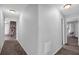 Hallway featuring carpeted floors and neutral wall colors leading to other rooms at 115 Lake Pines Ct, Roswell, GA 30076