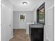 Bright laundry area with washer, dryer, sink, and outdoor access at 115 Lake Pines Ct, Roswell, GA 30076