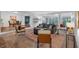 Open floor plan with living room leading into dining room and large picture windows at 115 Lake Pines Ct, Roswell, GA 30076