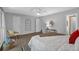 Cozy primary bedroom with a decorative chair, accent art and two bright windows at 115 Lake Pines Ct, Roswell, GA 30076