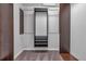 Walk-in closet featuring dark shelving and carpeted floors at 115 Lake Pines Ct, Roswell, GA 30076