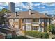 Charming condo building with manicured landscaping and a serene setting with skyline views at 200 Ne Renaissance Ne Pkwy # 304, Atlanta, GA 30308
