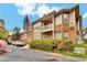 Apartment building exterior with well-maintained landscaping at 200 Ne Renaissance Ne Pkwy # 304, Atlanta, GA 30308