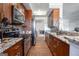 Modern kitchen featuring granite countertops, wood floors, and stainless steel appliances at 200 Ne Renaissance Ne Pkwy # 304, Atlanta, GA 30308